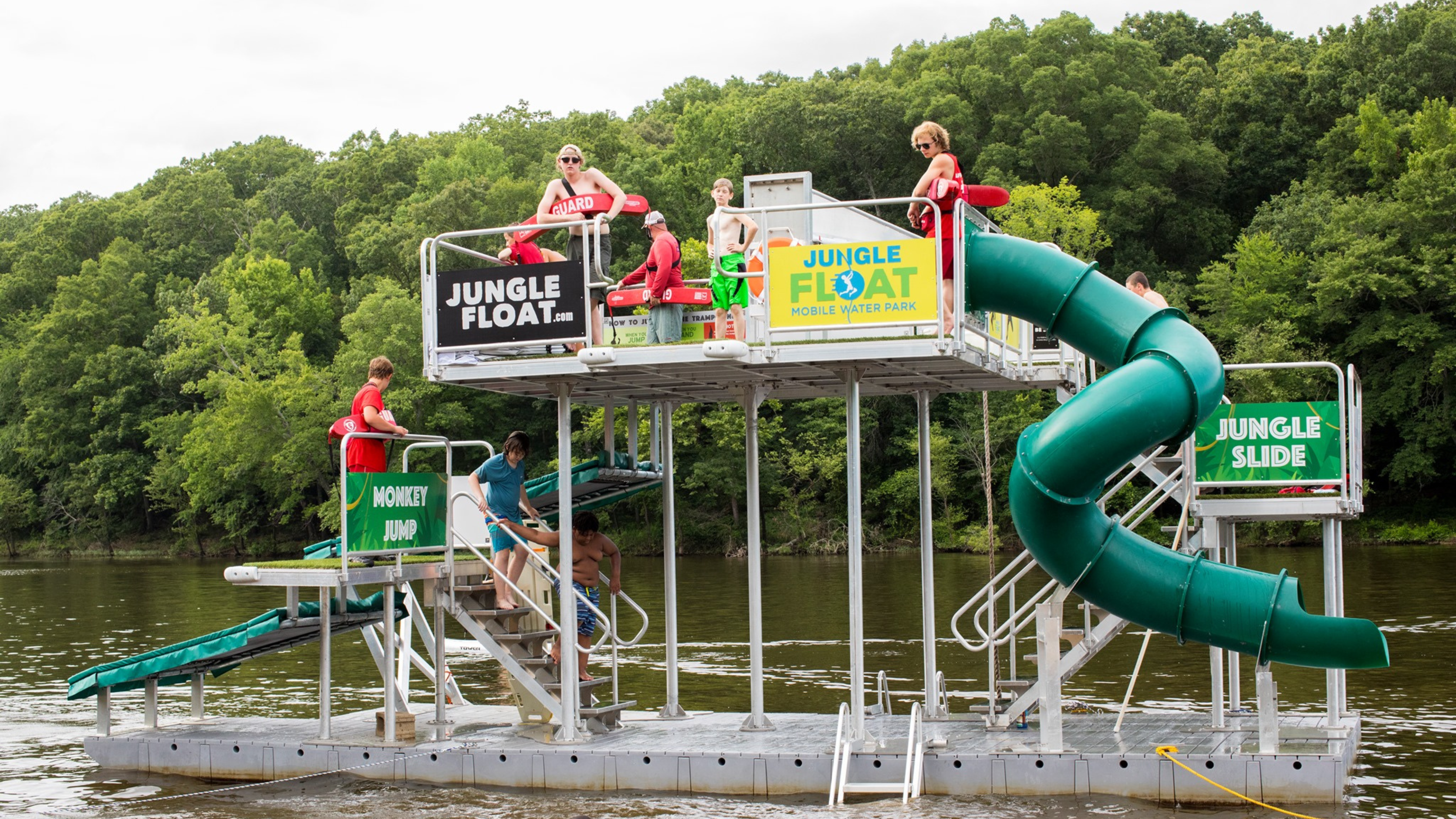 Image of a floating slide going into the water.